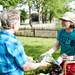 Cheryl Nowak sells lettuce from the Seeley Farm table on Tuesday, May 21. Daniel Brenner I AnnArbor.com
